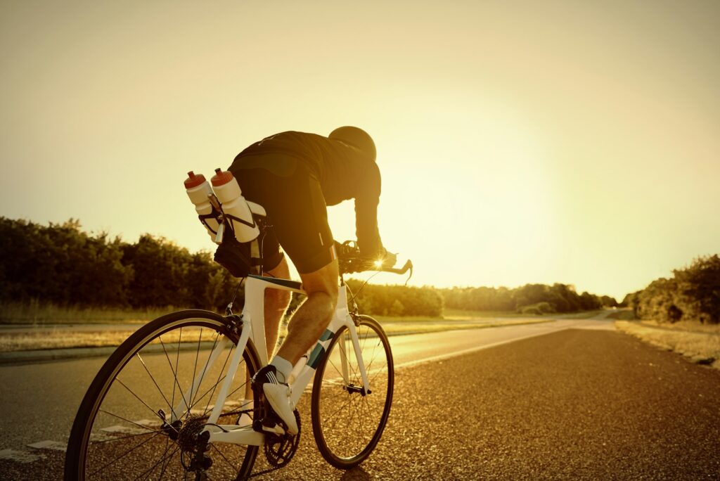 Sportsman riding a professional bike on road